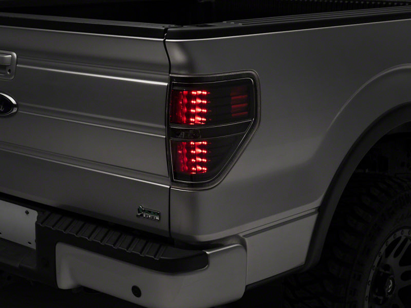 Load image into Gallery viewer, Raxiom 09-14 Ford F-150 Styleside LED Tail Lights- Blk Housing (Clear Lens)
