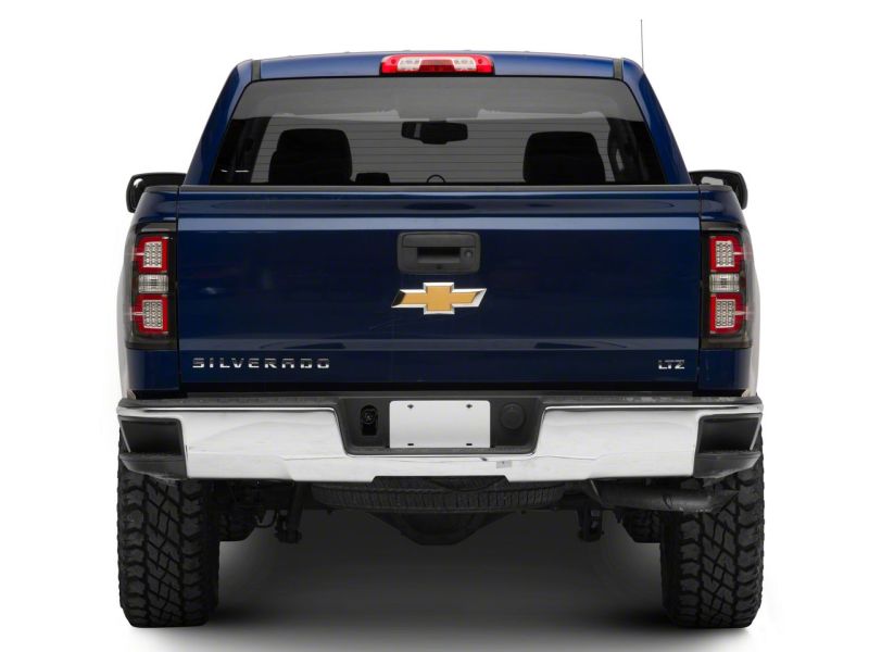 Load image into Gallery viewer, Raxiom 14-18 Chevrolet Silverado 1500 LED Taillights w/ SEQL Turn Signals- Blk Housing (Clear Lens)
