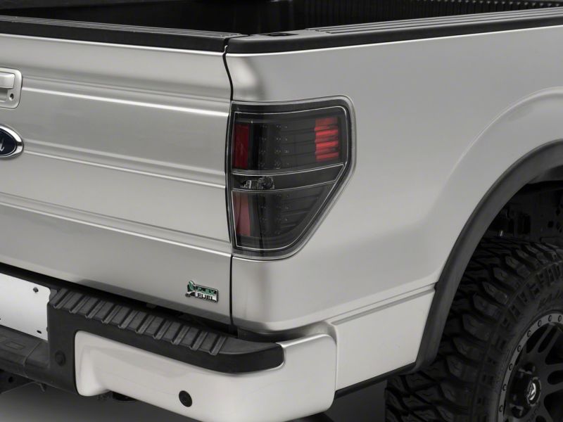 Load image into Gallery viewer, Raxiom 09-14 Ford F-150 Styleside LED Tail Lights- Blk Housing (Clear Lens)
