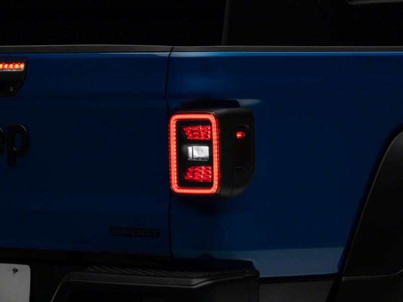 Load image into Gallery viewer, Raxiom 20-23 Jeep Gladiator JT LED Tail Lights- Blk Housing (Smoked Lens)
