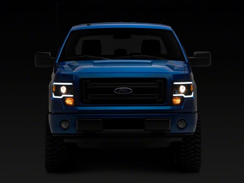 Load image into Gallery viewer, Raxiom 09-14 Ford F-150 Axial Series Projector Headlights w/ LED Light Bar- Blk Housing (Clear Lens)
