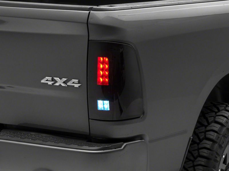 Load image into Gallery viewer, Raxiom 09-18 Dodge RAM 1500/2500/3500 Axial Series LED Tail Lights- Blk Housing (Smoked Lens)
