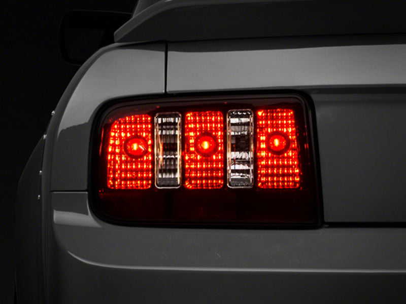 Load image into Gallery viewer, Raxiom 05-09 Ford Mustang Coyote Tail Lights- Blk Housing (Smoked Lens)
