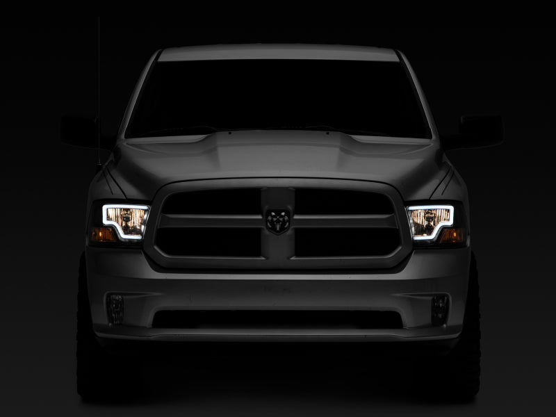 Load image into Gallery viewer, Raxiom 09-18 Dodge RAM 1500 LED Bar Headlights- Black Housing (Clear Lens)
