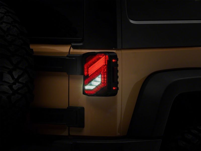 Load image into Gallery viewer, Raxiom 07-18 Jeep Wrangler JK Axial Series Trident LED Tail Lights- Blk Housing (Clear Lens)
