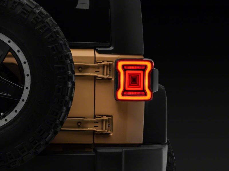 Load image into Gallery viewer, Raxiom 07-18 Jeep Wrangler JK Axial Series JL Style LED Tail Lights- BlkHousing- Red Lens
