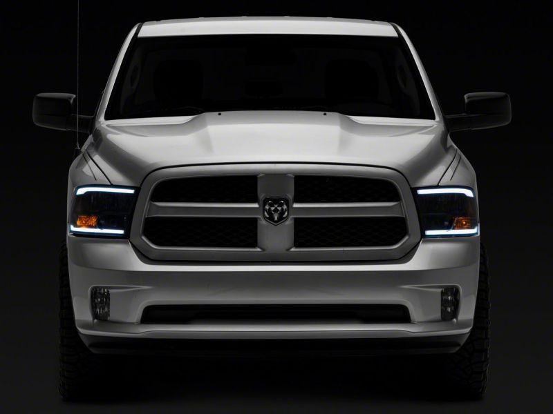 Load image into Gallery viewer, Raxiom 09-18 Dodge RAM 1500/2500/3500 Axial Series Headlights w/ LED Bar- Blk Housing (Clear Lens)
