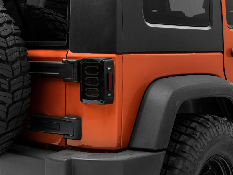 Load image into Gallery viewer, Raxiom 07-18 Jeep Wrangler JK LED Tail Lights- Black Housing (Smoked Lens)
