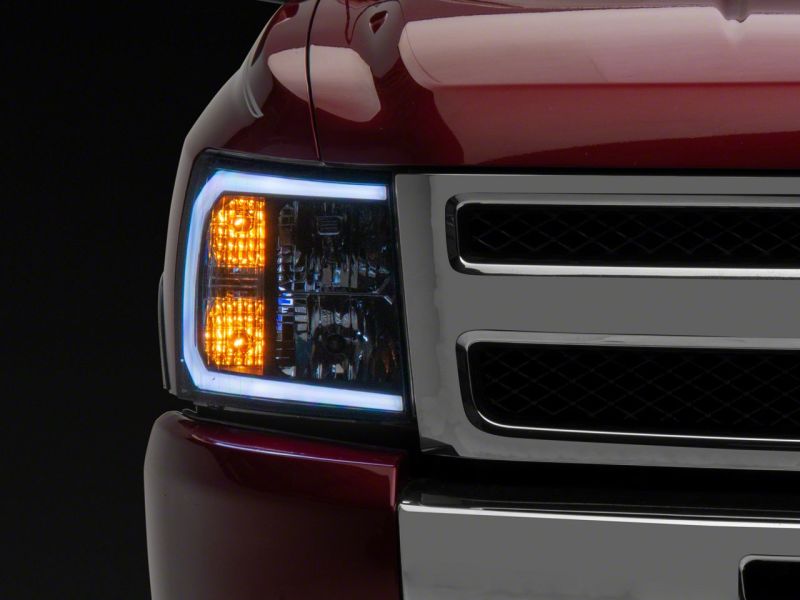 Load image into Gallery viewer, Raxiom 07-13 Chevrolet Silverado 1500 Axial Headlights w/ SEQL LED Bar- Blk Housing (Clear Lens)
