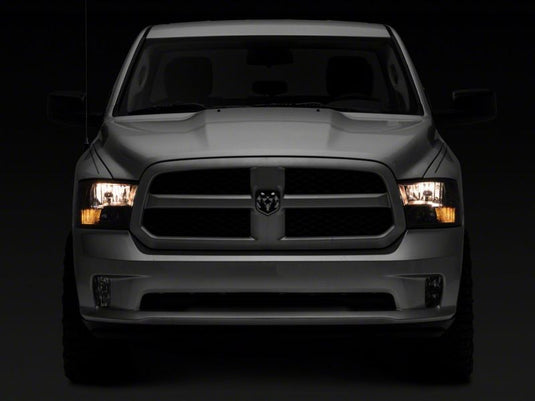 Raxiom 09-18 Dodge RAM 1500 Axial Series Euro Style Headlights w/ Dual Bulb Blk Housing (Clear Lens)