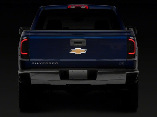 Raxiom 14-18 Chevrolet Silverado 1500 Axial Series LED Tail Lights- Blk Housing (Smoked Lens)