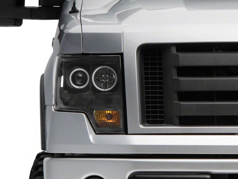 Load image into Gallery viewer, Raxiom 09-14 Ford F-150 Super White LED Halo Projector Headlights- Blk Housing (Clear Lens)
