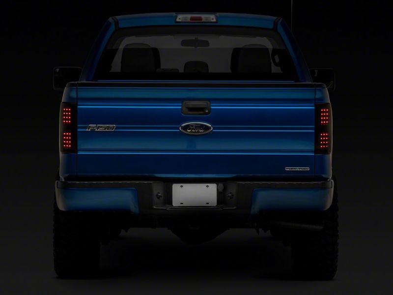 Load image into Gallery viewer, Raxiom 09-14 Ford F-150 Styleside Axial Series LED Tail Lights- Blk Housing (Smoked Lens)
