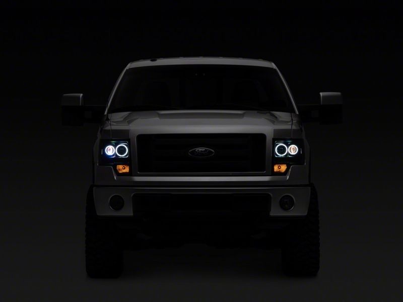 Load image into Gallery viewer, Raxiom 09-14 Ford F-150 Super White LED Halo Projector Headlights- Blk Housing (Clear Lens)
