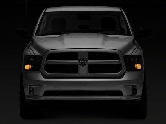 Raxiom 09-18 Dodge RAM 1500 Axial Series Euro Style Headlights w/ Dual Bulb Blk Housing (Clear Lens)