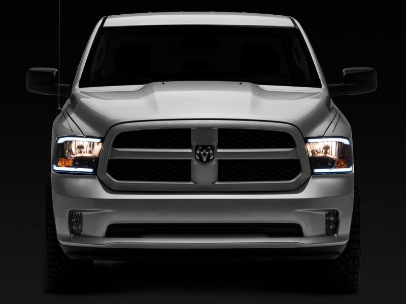 Load image into Gallery viewer, Raxiom 09-18 Dodge RAM 1500/2500/3500 Axial Series Headlights w/ LED Bar- Blk Housing (Clear Lens)
