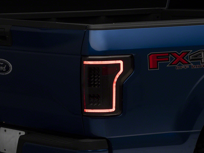 Load image into Gallery viewer, Raxiom 15-17 Ford F-150 LED Tail Lights w/ SEQL Turn Signals- Blk Housing (Clear Lens)
