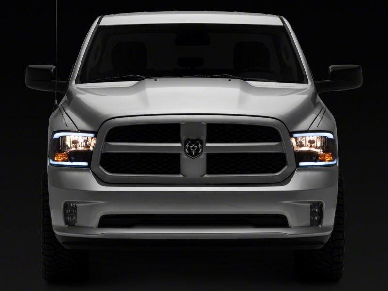 Load image into Gallery viewer, Raxiom 09-18 Dodge RAM 1500/2500/3500 Axial Headlights w/ SEQL LED Bar- Blk Housing (Clear Lens)
