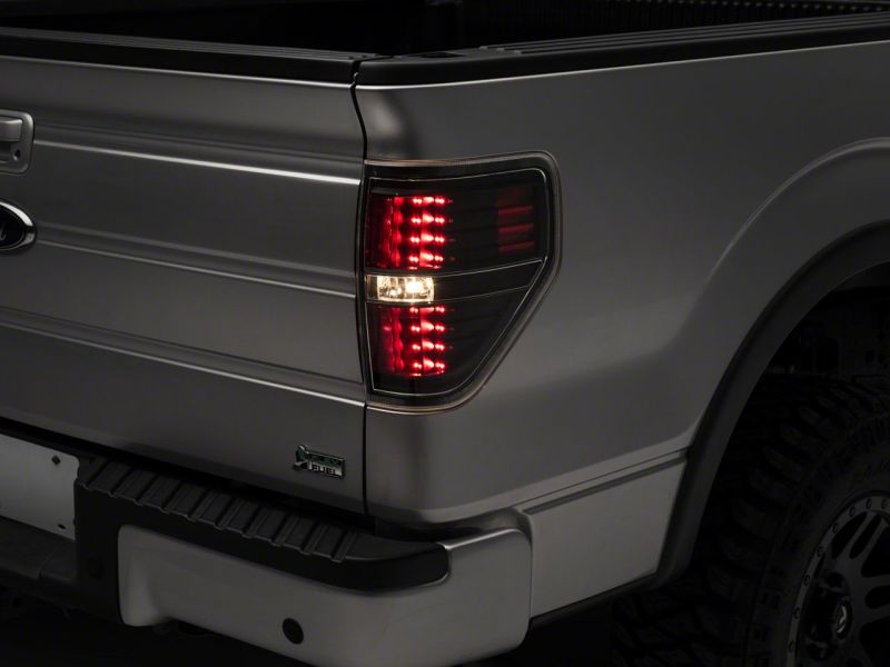 Load image into Gallery viewer, Raxiom 09-14 Ford F-150 Styleside LED Tail Lights- Blk Housing (Clear Lens)
