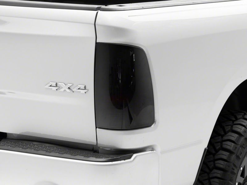 Load image into Gallery viewer, Raxiom 09-18 Dodge RAM 1500/2500/3500 Axial Series LED Tail Lights- BlkHousing- SmokedLens
