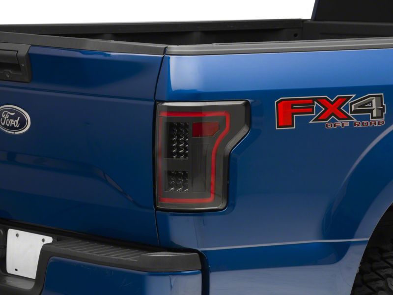 Load image into Gallery viewer, Raxiom 15-17 Ford F-150 LED Tail Lights w/ SEQL Turn Signals- Blk Housing (Clear Lens)
