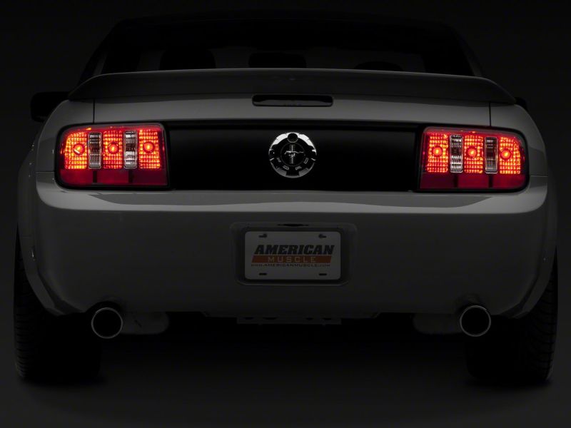 Load image into Gallery viewer, Raxiom 05-09 Ford Mustang Coyote Tail Lights- Chrome Housing - Red/Clear Lens
