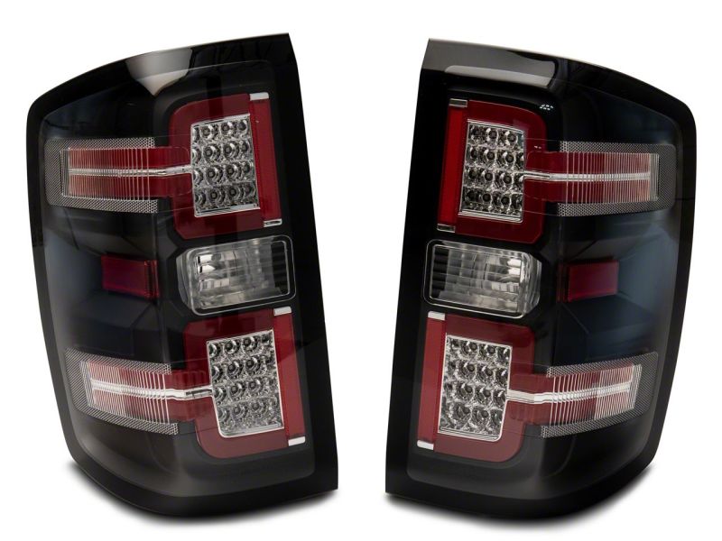 Load image into Gallery viewer, Raxiom 14-18 Chevrolet Silverado 1500 LED Taillights w/ SEQL Turn Signals- Blk Housing (Clear Lens)
