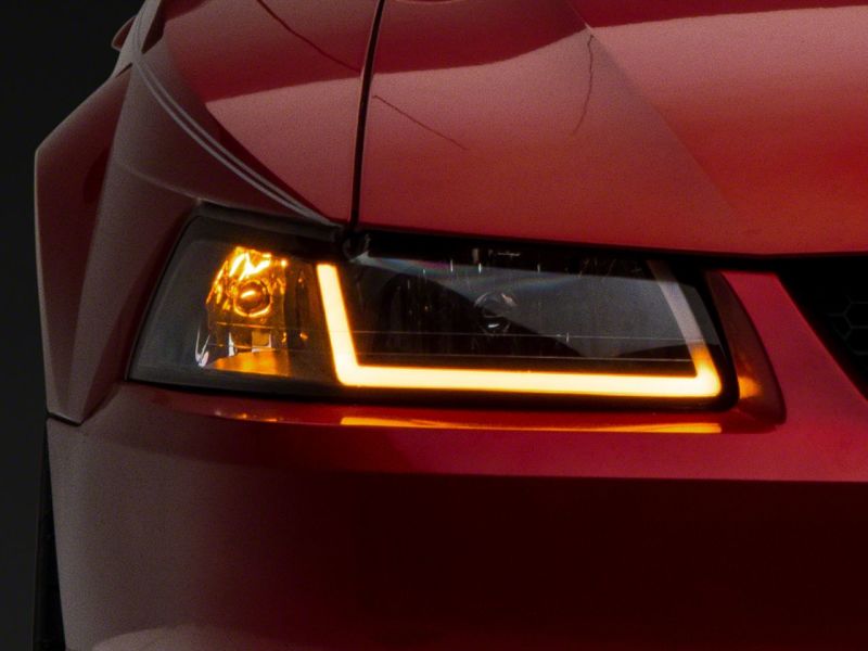 Load image into Gallery viewer, Raxiom 99-04 Ford Mustang Axial Series Headlights w/ Sequential LED Bar- Blk Housing (Clear Lens)
