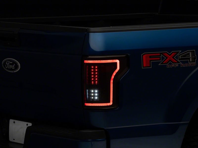 Load image into Gallery viewer, Raxiom 15-17 Ford F-150 LED Tail Lights w/ SEQL Turn Signals- Blk Housing (Clear Lens)
