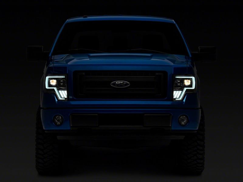 Load image into Gallery viewer, Raxiom 09-14 Ford F-150 Axial G4 Light Bar Switchback Projector Headlights- Blk Housing (Clear Lens)
