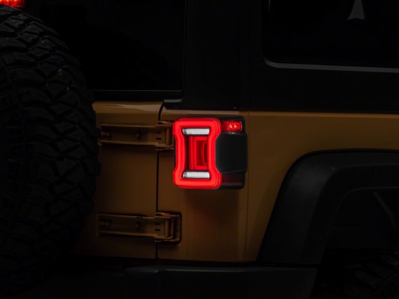 Load image into Gallery viewer, Raxiom 07-18 Jeep Wrangler JK Axial Series JL Style LED Tail Lights- BlkHousing- Red Lens
