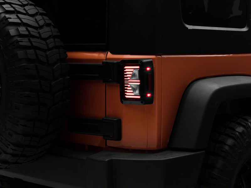 Load image into Gallery viewer, Raxiom 07-18 Jeep Wrangler JK Axial Series Vision LED Tail Lights- Blk Housing (Clear Lens)
