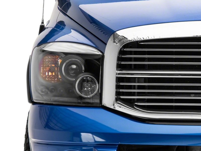 Load image into Gallery viewer, Raxiom 06-08 Dodge RAM 1500 LED Halo Projector Headlights- Blk Housing (Clear Lens)
