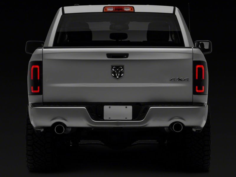 Load image into Gallery viewer, Raxiom 09-18 Dodge RAM 1500/2500/3500 Axial Series LED Tail Lights- Blk Housing (Smoked Lens)
