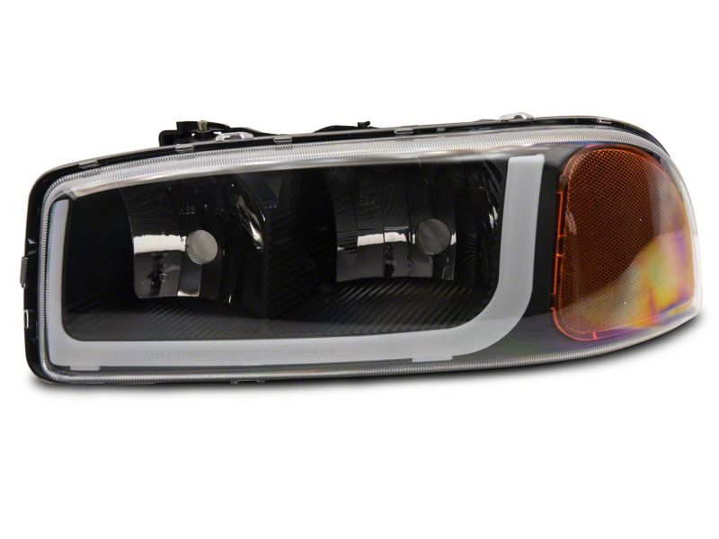 Load image into Gallery viewer, Raxiom 99-06 GMC Sierra 1500 Axial Series Headlights w/ LED Bar- Black Housing (Clear Lens)
