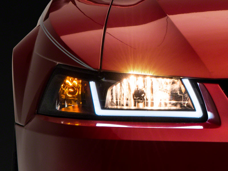 Load image into Gallery viewer, Raxiom 99-04 Ford Mustang Axial Series Headlights w/ LED Bar- Black Housing (Clear Lens)
