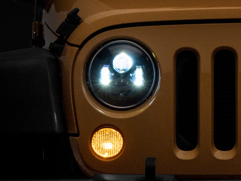 Load image into Gallery viewer, Raxiom 07-18 Jeep Wrangler JK 7-In LED Headlights- Blk Housing (Clear Lens)
