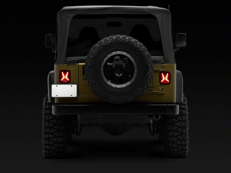 Load image into Gallery viewer, Raxiom 76-06 Jeep CJ7 Wrangler YJ &amp; TJ Gladiator LED Tail Lights- Blk Housing (Smoked Lens)
