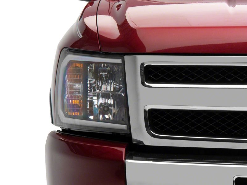 Load image into Gallery viewer, Raxiom 07-13 Chevrolet Silverado 1500 Axial Headlights w/ SEQL LED Bar- Blk Housing (Clear Lens)
