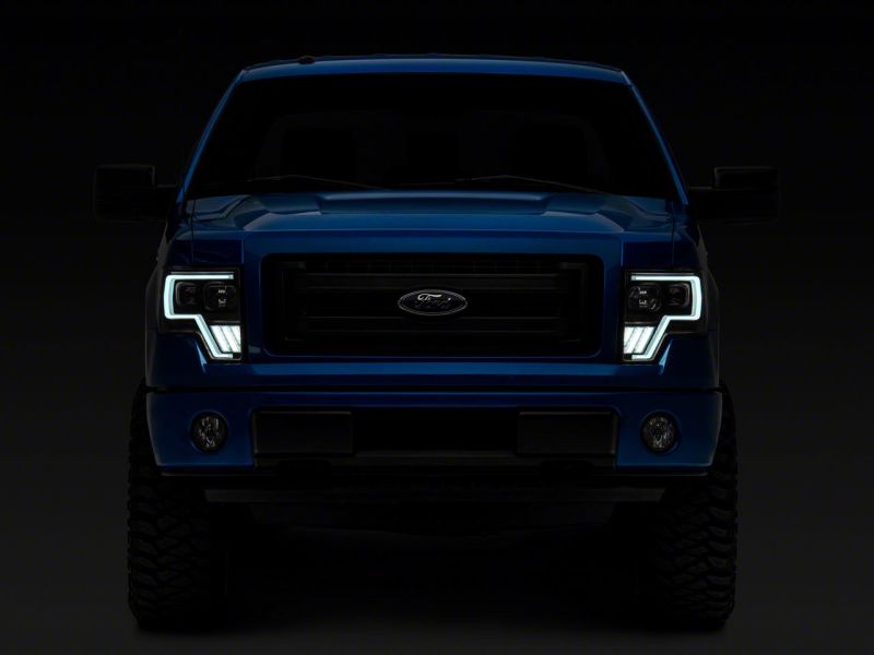 Load image into Gallery viewer, Raxiom 09-14 Ford F-150 Axial G4 Light Bar Switchback Projector Headlights- Blk Housing (Clear Lens)
