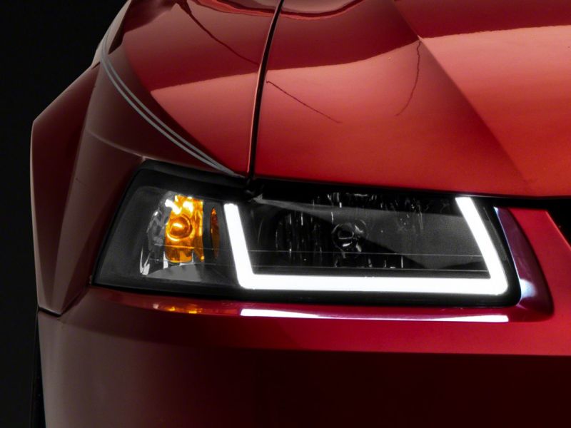 Load image into Gallery viewer, Raxiom 99-04 Ford Mustang Axial Series Headlights w/ LED Bar- Black Housing (Clear Lens)
