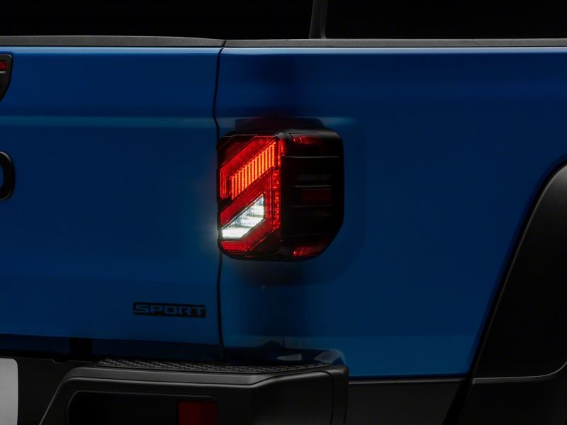 Load image into Gallery viewer, Raxiom 20-23 Jeep Gladiator JT Axial Series LED Tail Lights- Blk Housing (Smoked Lens)
