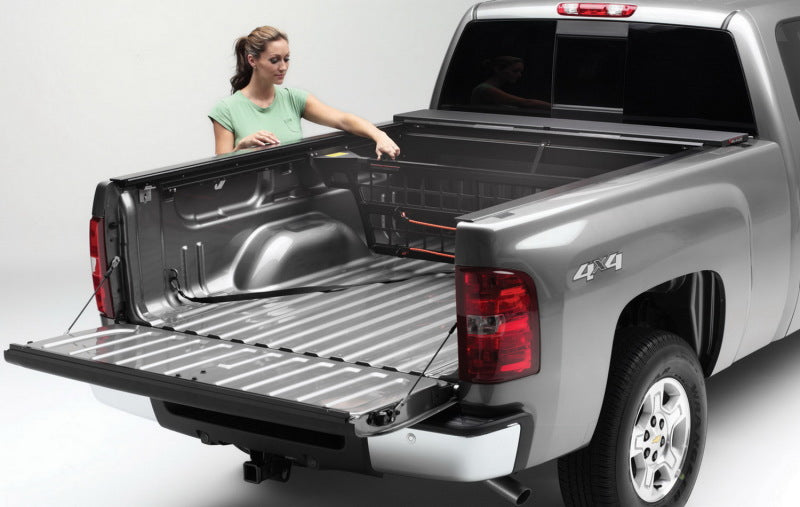 Load image into Gallery viewer, Roll-N-Lock 07-13 Chevy Silverado/Sierra w/ OE Rail Caps LB 96-1/4in Cargo Manager
