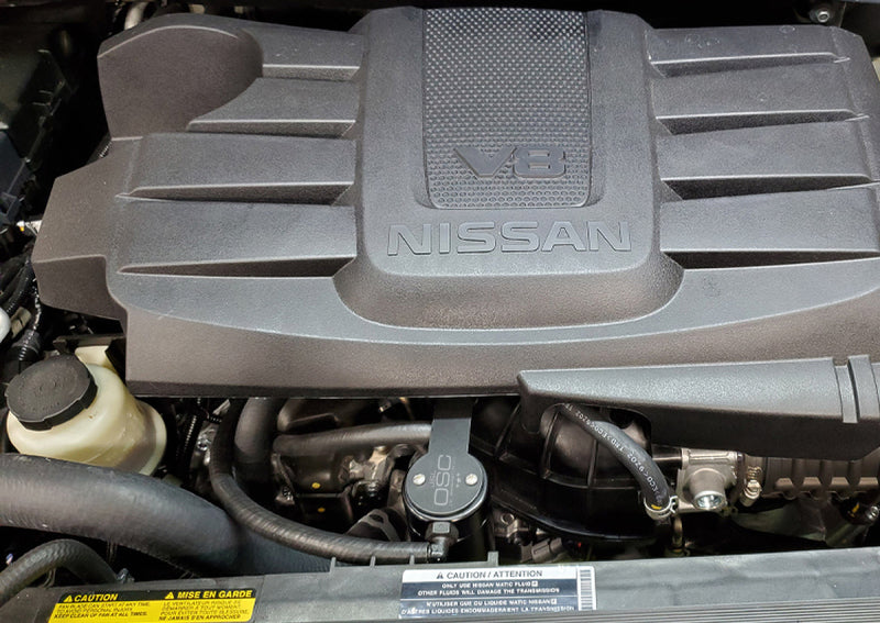 Load image into Gallery viewer, J&amp;L 16-24 Nissan Titan 5.6L Passenger Side Oil Separator 3.0 - Black Anodized
