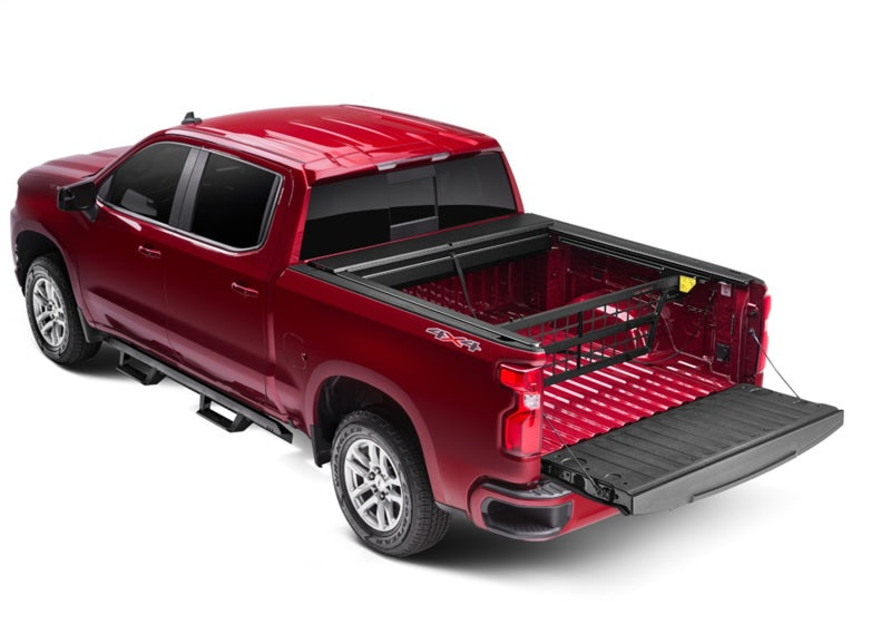 Load image into Gallery viewer, Roll-N-Lock 07-13 Chevy Silverado/Sierra w/ OE Rail Caps LB 96-1/4in Cargo Manager
