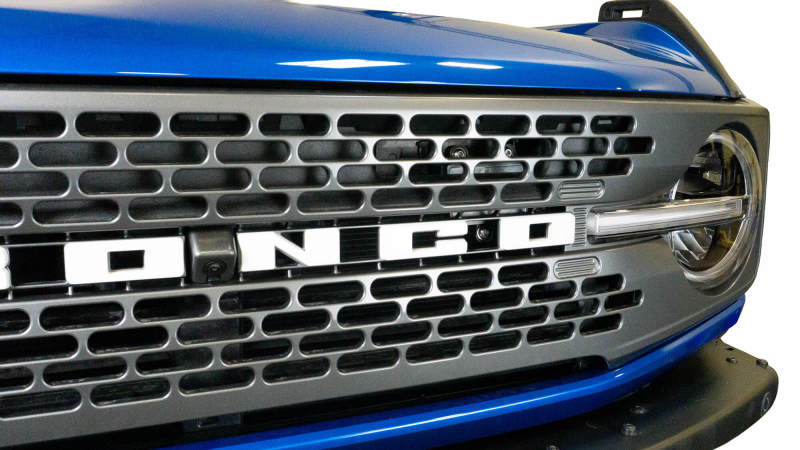 Load image into Gallery viewer, DV8 Offroad 2021+ Ford Bronco Adaptive Cruise Control Relocation Bracket
