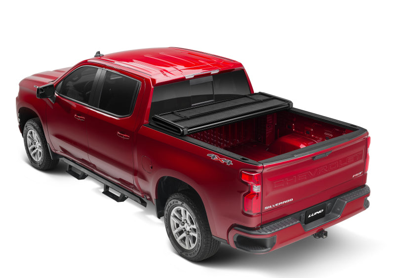 Load image into Gallery viewer, Lund 07-13 Chevy Silverado 1500 Fleetside (8ft. Bed) Hard Fold Tonneau Cover - Black
