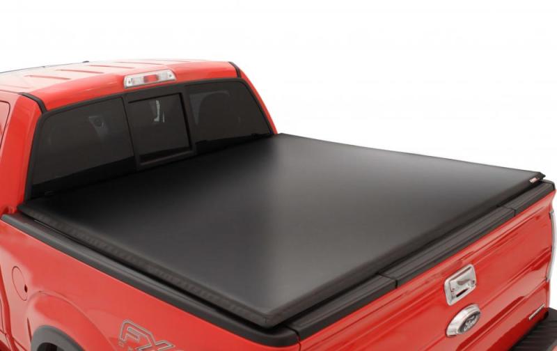 Load image into Gallery viewer, Lund 15-18 Ford F-150 (5.5ft. Bed) Genesis Tri-Fold Tonneau Cover - Black
