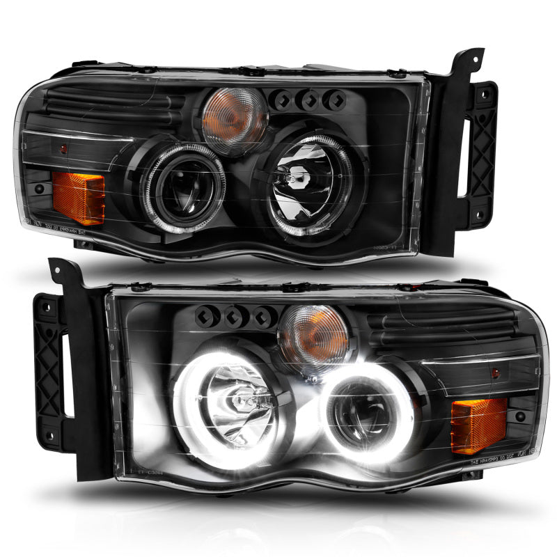 Load image into Gallery viewer, ANZO 2002-2005 Dodge Ram 1500 Projector Headlights w/ Halo Black Clear Amber
