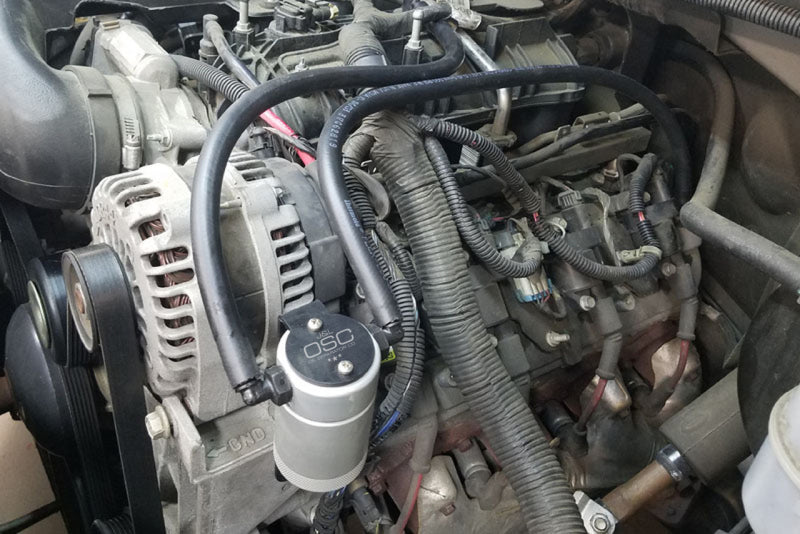 Load image into Gallery viewer, J&amp;L 97-13 Chevy/GM Truck/SUV 4.8L/5.3L/6.0L/6.2L Driver Side Oil Separator 3.0 - Clear Anodized
